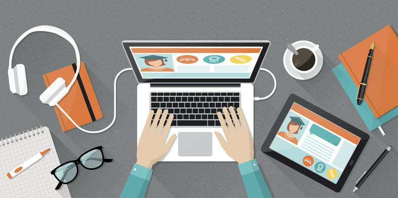 Cartoon of hands typing on computer with headphones and tablet on desk