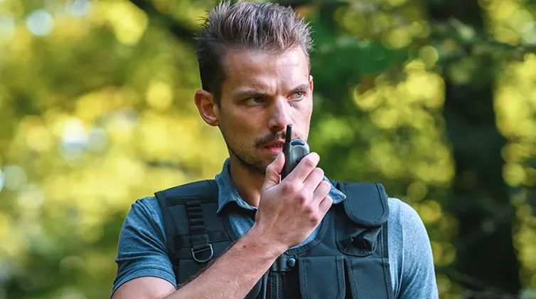 criminal justice professional speaking on walkie talkie