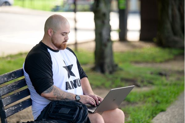 AMU student working on laptop