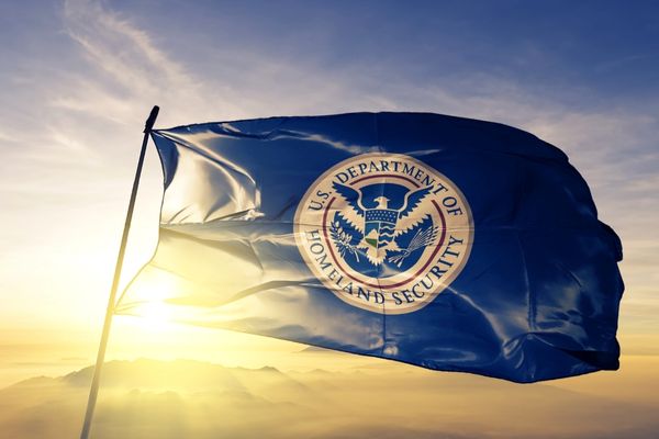 US Department of Homeland Security Flag waving at sunrise