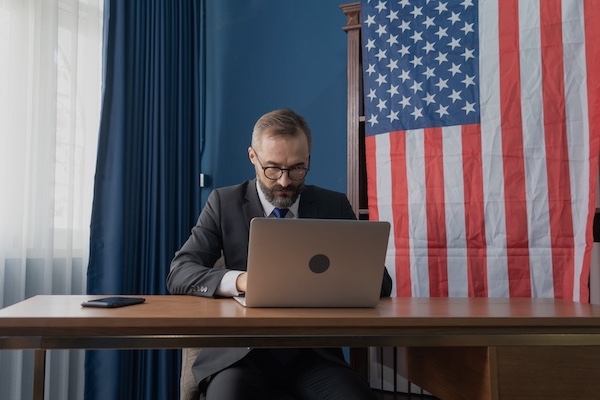 ATF agent working on laptop