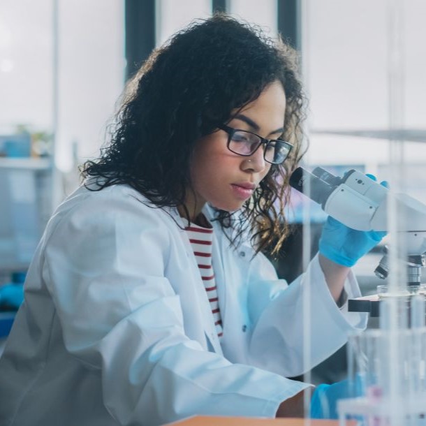 natural science student with microscope