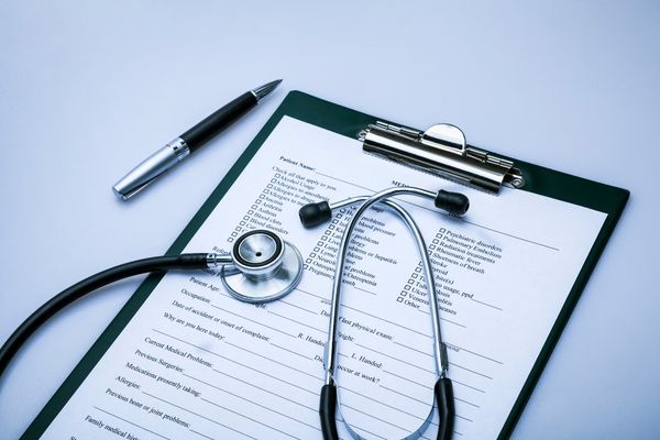 public health document and stethoscope