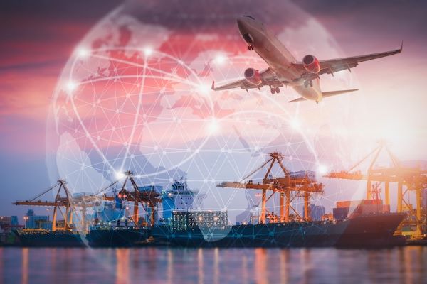 supply chain management airplane flying over shipping port
