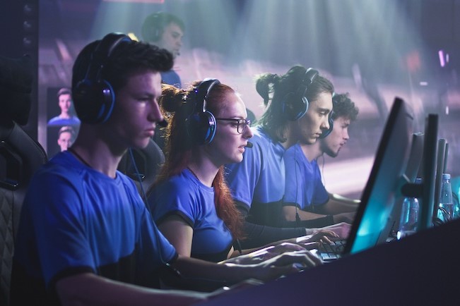 esports gamers at row of computers
