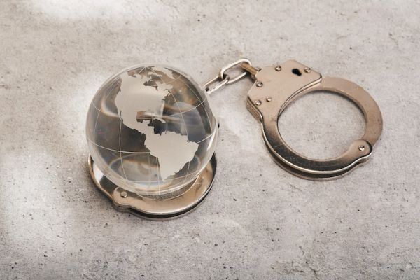 glass globe with handcuffs