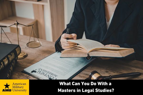 masters in legal studies student with book