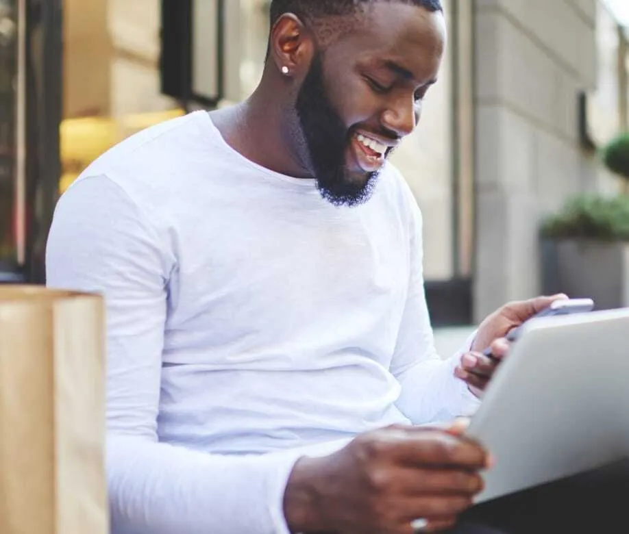 man smiling at phone