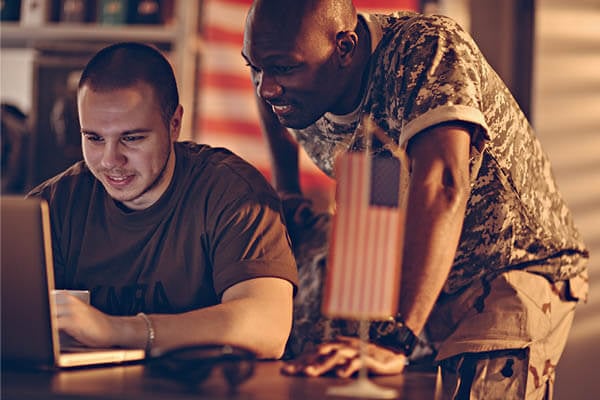 Two Servicemen Looking at Laptop