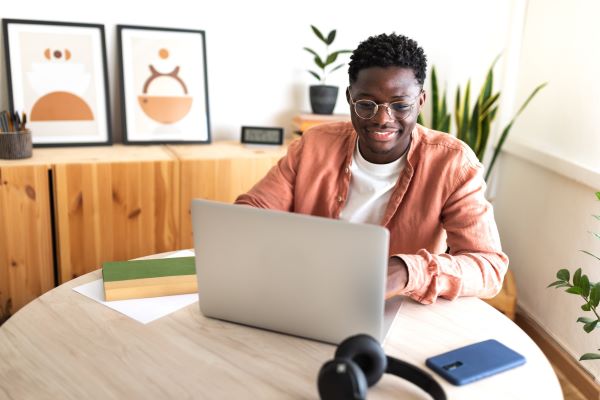 student reading article on laptop computer