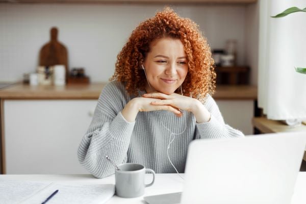 female student preparing to take test on laptop