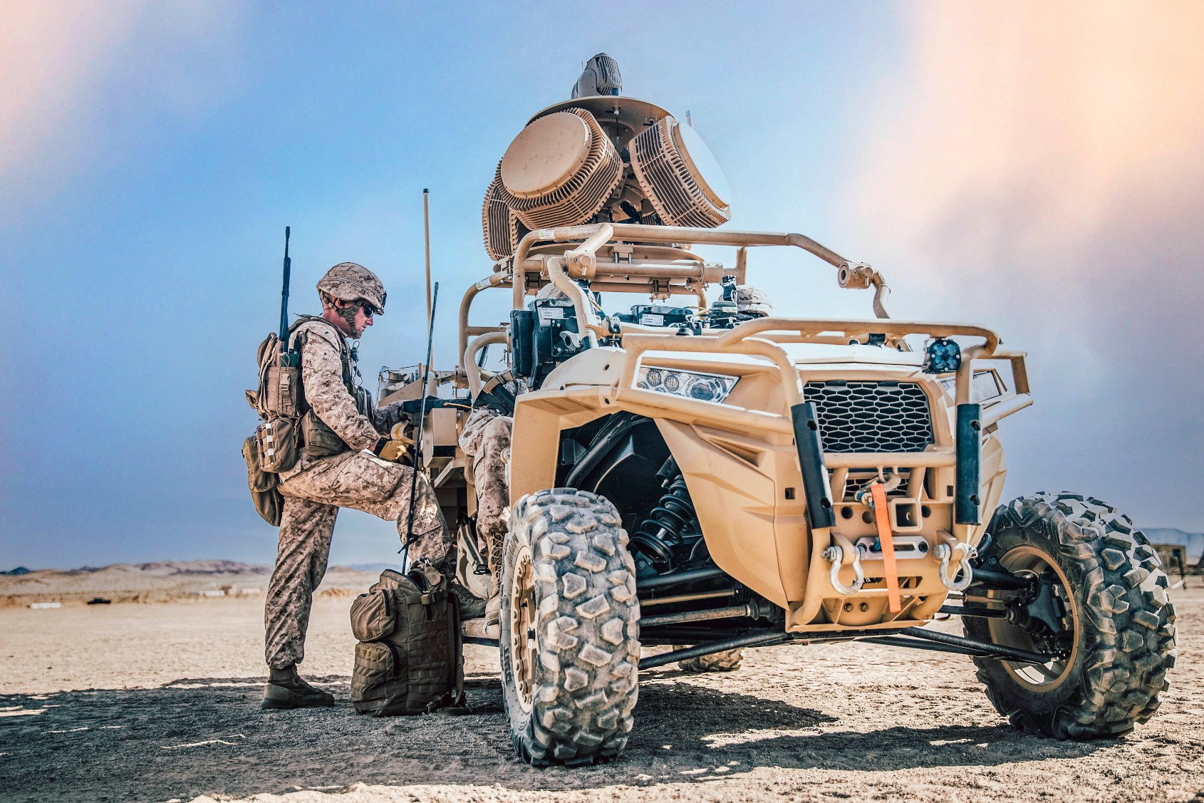 Military Man Standing Beside Military Truck
